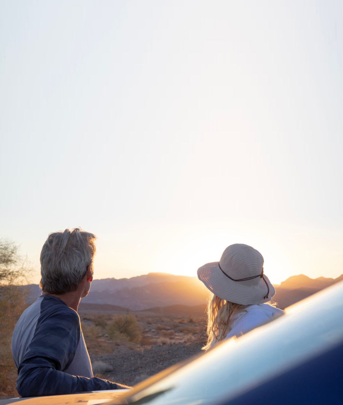 A couple looking at the sunset.